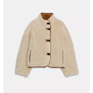 Chic Cream Shearling Jacket with Brown Details